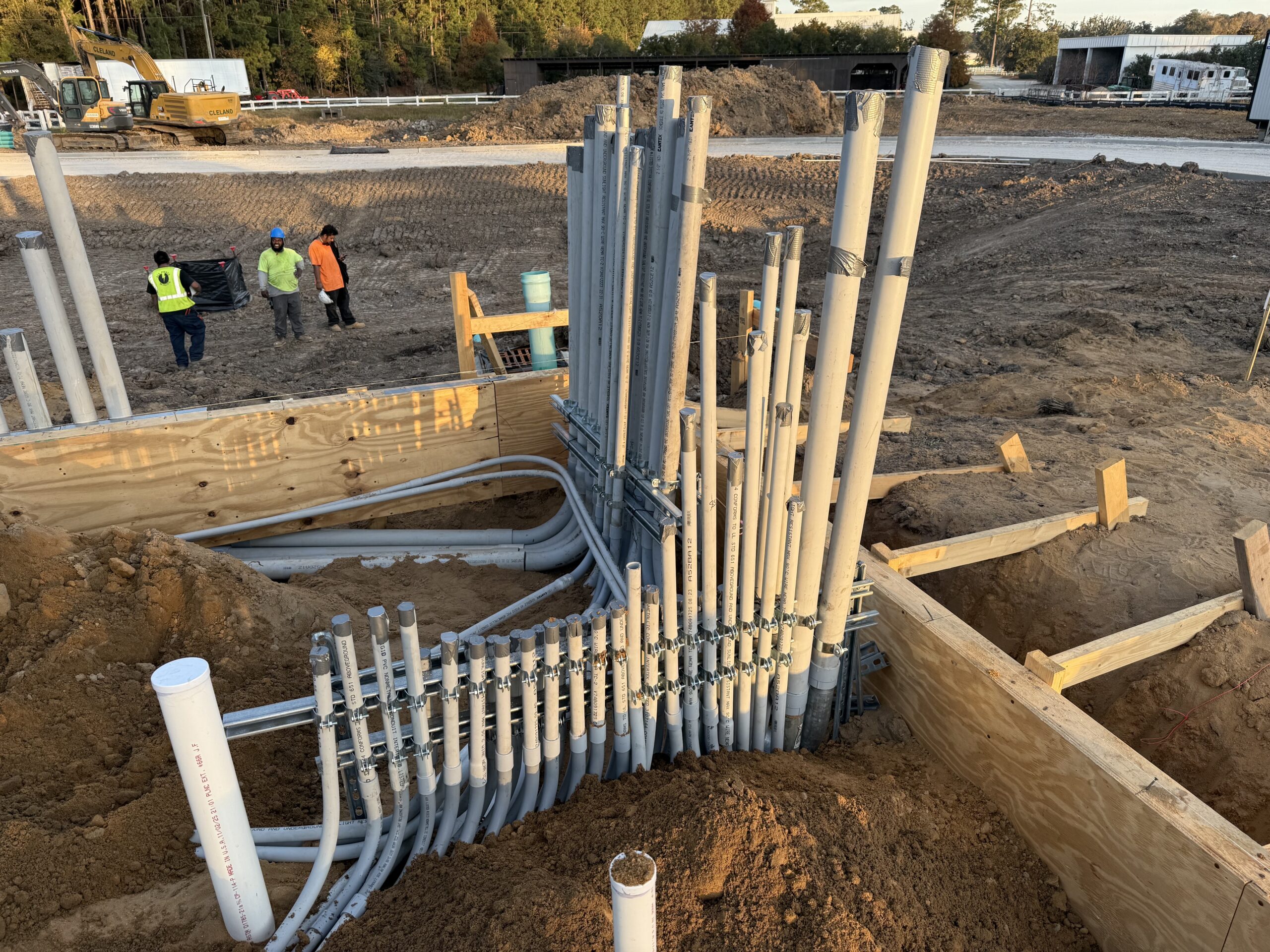 Electrical conduit pipes installed at a construction site.